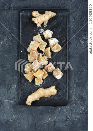 Ginger candies and fresh ginger. Ginger candies and fresh ginger. 116989390