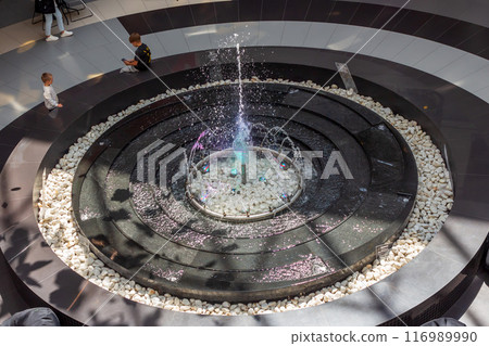 The beauty of a fountain on a sunny day 116989990