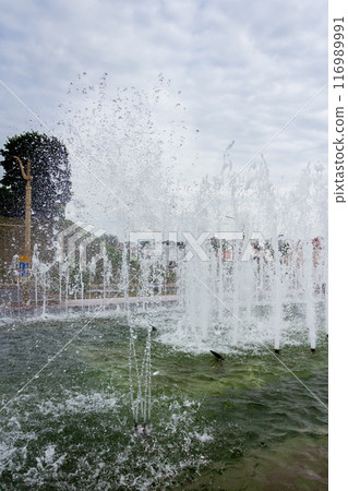 The beauty of a fountain on a sunny day 116989991