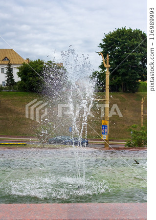 The beauty of a fountain on a sunny day 116989993