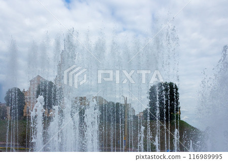 The beauty of a fountain on a sunny day The beauty of a fountain on a sunny day 116989995