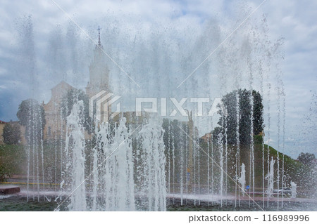 The beauty of a fountain on a sunny day 116989996