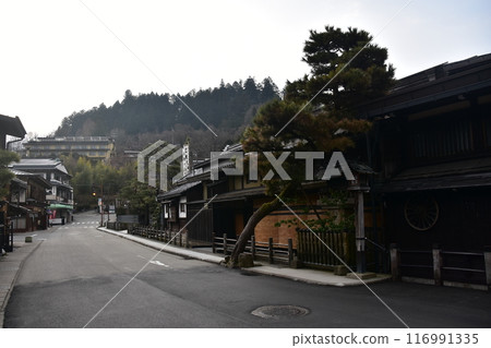 Spring in Gifu Prefecture, Japan: Old streets in the center of Takayama City, Japanese houses with a sense of history and magnificent pine trees Spring in Gifu Prefecture, Japan: Old streets in the center of Takayama City, Japanese houses with a sense of history and magnificent pine trees 116991335
