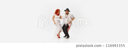 Banner. Engaged in romantic salsa training, dancers' movements flow with rhythm of love against white background. Copy space. Banner. Engaged in romantic salsa training, dancers' movements flow with rhythm of love against white background. Copy space. 116991355