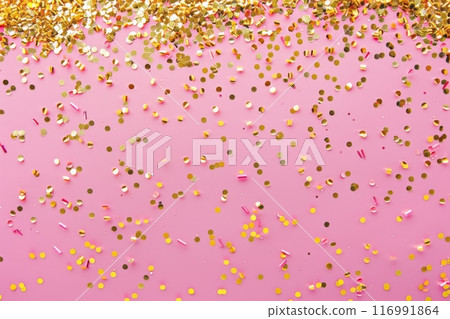 Delicate pink hues provide the perfect stage for a shower of golden confetti, bringing sparkle and cheer to the scene, infusing it with warmth and excitement 116991864
