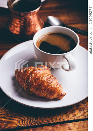 Cup of Black Coffee and Fresh Croissant 116992754
