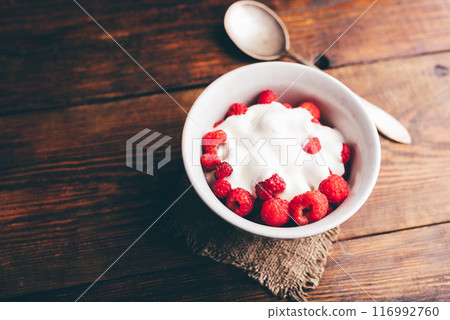 Bowl of Summer Dessert with Raspberries and Greek Yogurt 116992760