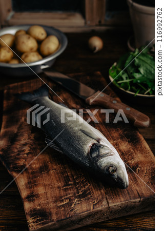 Sea Bass Ready to Be Cooked with Potatoes and Herbs Sea Bass Ready to Be Cooked with Potatoes and Herbs 116992762