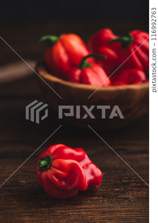 Red Habanero Pepper on a Wooden Table Red Habanero Pepper on a Wooden Table 116992763