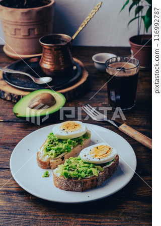 Two avocado toasts with boiled egg 116992787