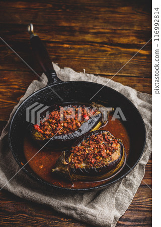 Eggplants stuffed with ground beef and tomatoes 116992814
