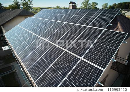 Aerial top view of new modern house cottage with solar photovoltaic panel system on house roof 116993420