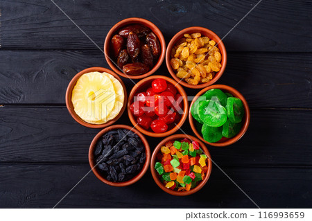 Group of dried and candied fruit in bowl Group of dried and candied fruit in bowl 116993659