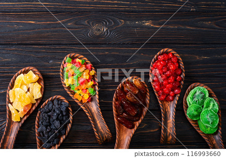 Group of dried and candied fruit in bowl 116993660