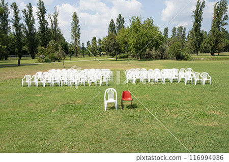 Red and white empty chairs 116994986