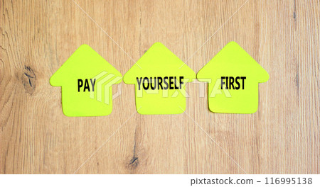 Pay yourself first symbol. Concept words Pay yourself first on beautiful yellow paper houses. Beautiful wooden table wooden background. Business and pay yourself first concept. Copy space. 116995138