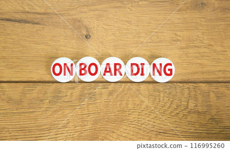 Onboarding success symbol. Concept word Onboarding on white pill. Beautiful wooden background. Business onboarding success concept. Copy space. 116995260
