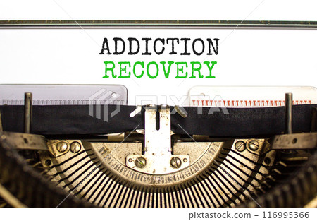 Addiction recovery symbol. Concept words Addiction recovery typed on beautiful old retro typewriter. Beautiful white paper background. Psychology addiction recovery concept. Copy space. 116995366