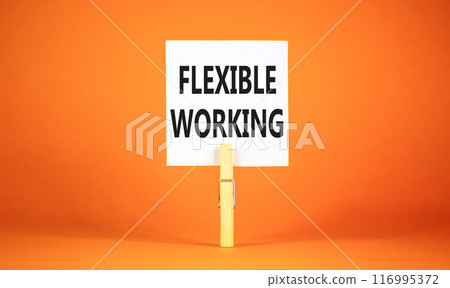 Flexible working symbol. Concept words Flexible working on beautiful white paper on wooden clothespin. Beautiful orange background. Business flexible working concept. Copy space. 116995372