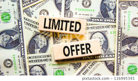 Limited offer symbol. Concept words Limited offer on beautiful wooden block. Beautiful background from dollar bills. Dollar bills. Business marketing, motivational Limited offer concept. Copy space. 116995391
