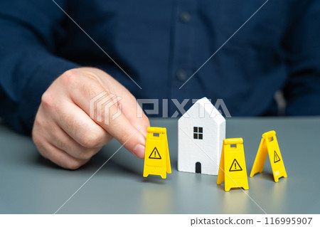 A man installs restriction signs around the house. Asset freezing. Property seizure. Foreclosure for debts and non-payment of mortgages. Emergency housing requiring repair. Building contamination. A man installs restriction signs around the house. Asset freezing. Property seizure. Foreclosure for debts and non-payment of mortgages. Emergency housing requiring repair. Building contamination. 116995907