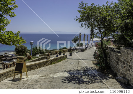 Greece, Afytos, View of Afytos with its shops, restaurants and terraces Greece, Afytos, View of Afytos with its shops, restaurants and terraces 116996113