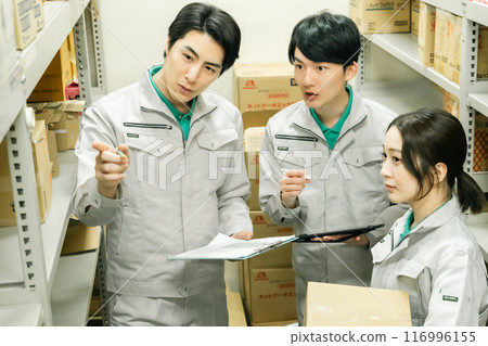 A young group managing inventory in the back yard A young group managing inventory in the back yard 116996155