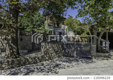 Greece, Nikiti, Street of the old town of Nikiti with its stone houses. Greece, Nikiti, Street of the old town of Nikiti with its stone houses. 116996226