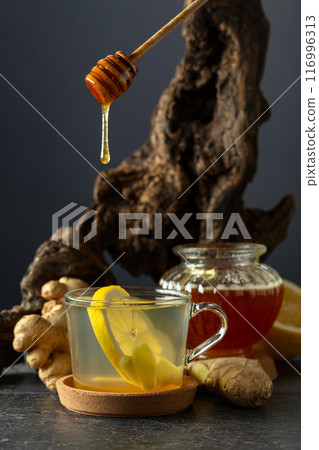 Ginger tea with lemon and honey. 116996313