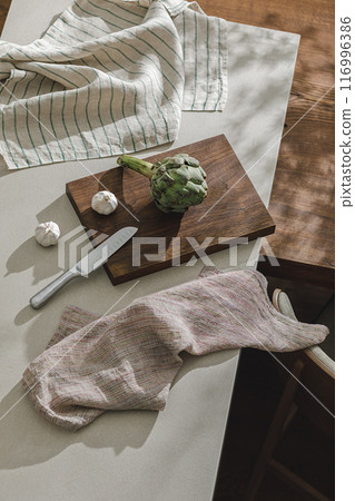 Assortment of fresh vegetables, linen towels and stainless still kitchen appliances. Healthy food cooking ingredients background with fresh vegetables Assortment of fresh vegetables, linen towels and stainless still kitchen appliances. Healthy food cooking ingredients background with fresh vegetables 116996386