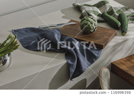 Assortment of fresh vegetables, linen towels and stainless still kitchen appliances. Healthy food cooking ingredients background with fresh vegetables 116996398