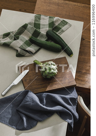 Assortment of fresh vegetables, linen towels and stainless still kitchen appliances. Healthy food cooking ingredients background with fresh vegetables Assortment of fresh vegetables, linen towels and stainless still kitchen appliances. Healthy food cooking ingredients background with fresh vegetables 116996400