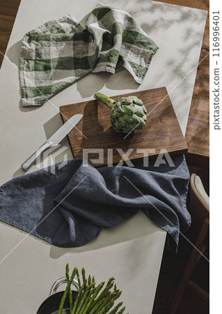 Assortment of fresh vegetables, linen towels and stainless still kitchen appliances. Healthy food cooking ingredients background with fresh vegetables Assortment of fresh vegetables, linen towels and stainless still kitchen appliances. Healthy food cooking ingredients background with fresh vegetables 116996401