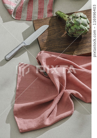 Fresh artichoke, linen textile. Healthy food cooking ingredients background with fresh vegetables Fresh artichoke, linen textile. Healthy food cooking ingredients background with fresh vegetables 116996403