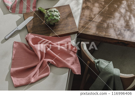 Fresh artichoke, linen textile. Healthy food cooking ingredients background with fresh vegetables Fresh artichoke, linen textile. Healthy food cooking ingredients background with fresh vegetables 116996406
