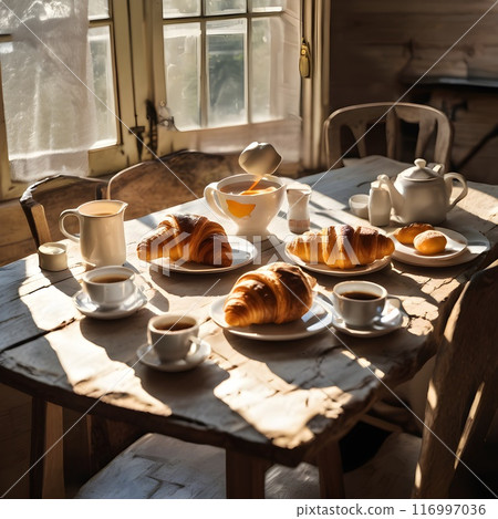 Sunlit Kitchen Table with Breakfast Items 116997036