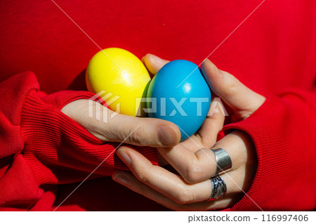 Enchanting Woman Embracing Vibrant Easter Eggs 116997406