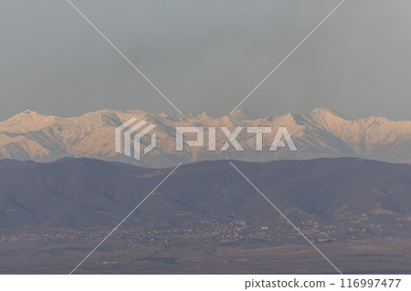 Majestic Snow-Capped Peaks of the Georgian Mountain Range 116997477