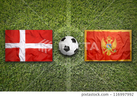 Denmark vs. Montenegro flags on soccer field 116997992