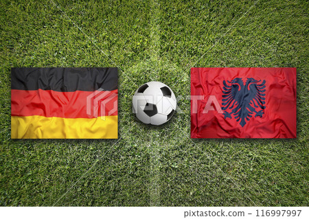 Germany vs. Albania flags on soccer field Germany vs. Albania flags on soccer field 116997997
