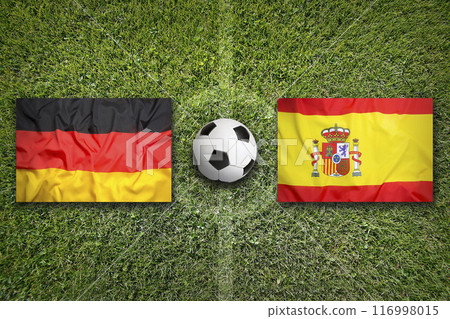 Germany vs. Spain flags on soccer field 116998015
