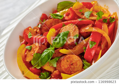 zesty italian sausage peppers and onions, top view zesty italian sausage peppers and onions, top view 116998623