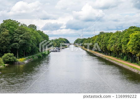 The Bocholt Herentals Canal with green banks and pleasure ships around Neerpelt, Limburg, Belgium The Bocholt Herentals Canal with green banks and pleasure ships around Neerpelt, Limburg, Belgium 116999222