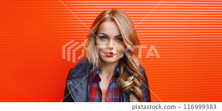 Portrait beautiful young blonde woman posing in black leather jacket on colorful background 116999383
