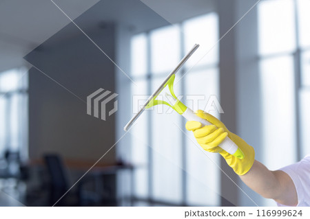 Cleaning windows in a light room. Cleaning windows in a light room. 116999624