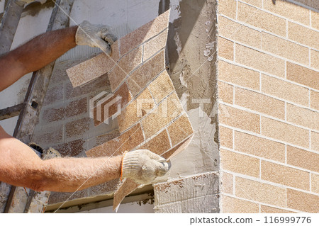 Flexible thin faux brick panels are composed of marble chips, acrylic water dispersion and coloring pigments. 116999776