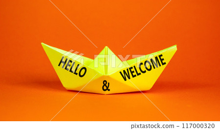 Hello and welcome symbol. Concept words Hello and welcome on beautiful yellow paper boat. Beautiful orange background. Business hello and welcome concept. Copy space. Hello and welcome symbol. Concept words Hello and welcome on beautiful yellow paper boat. Beautiful orange background. Business hello and welcome concept. Copy space. 117000320