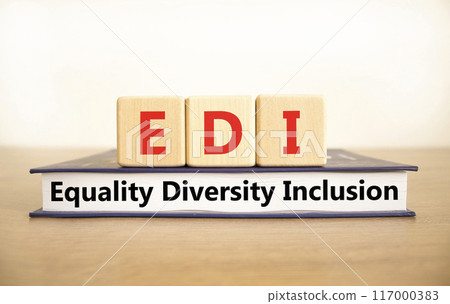 EDI equality diversity inclusion symbol. Concept words EDI equality diversity inclusion on blocks and book. Beautiful white background. Business EDI equality diversity inclusion concept. Copy space. 117000383