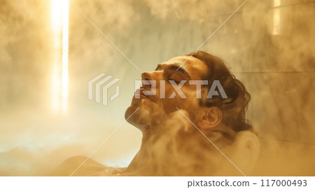 Man in spa in hot spring pool in luxury spa  117000493