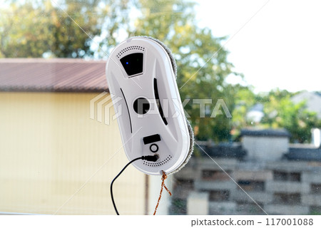 Modern device for cleaning glass from dirt and streaks. Robot washer vacuum cleaner with microfiber. 117001088